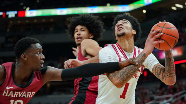 Indiana Hoosiers center Kel'el Ware (1) is fouled by Harvard Crimson forward Chisom Okpara (10) during the game against Harvard in Gainbridge Fieldhouse.  